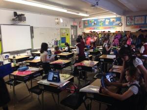 My class thoroughly engaged in their iMovie project.